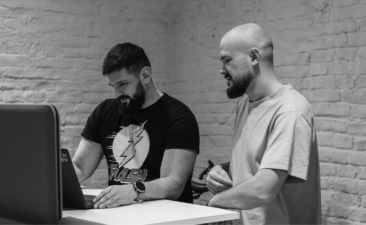 TH-EY team members programmers working together photo